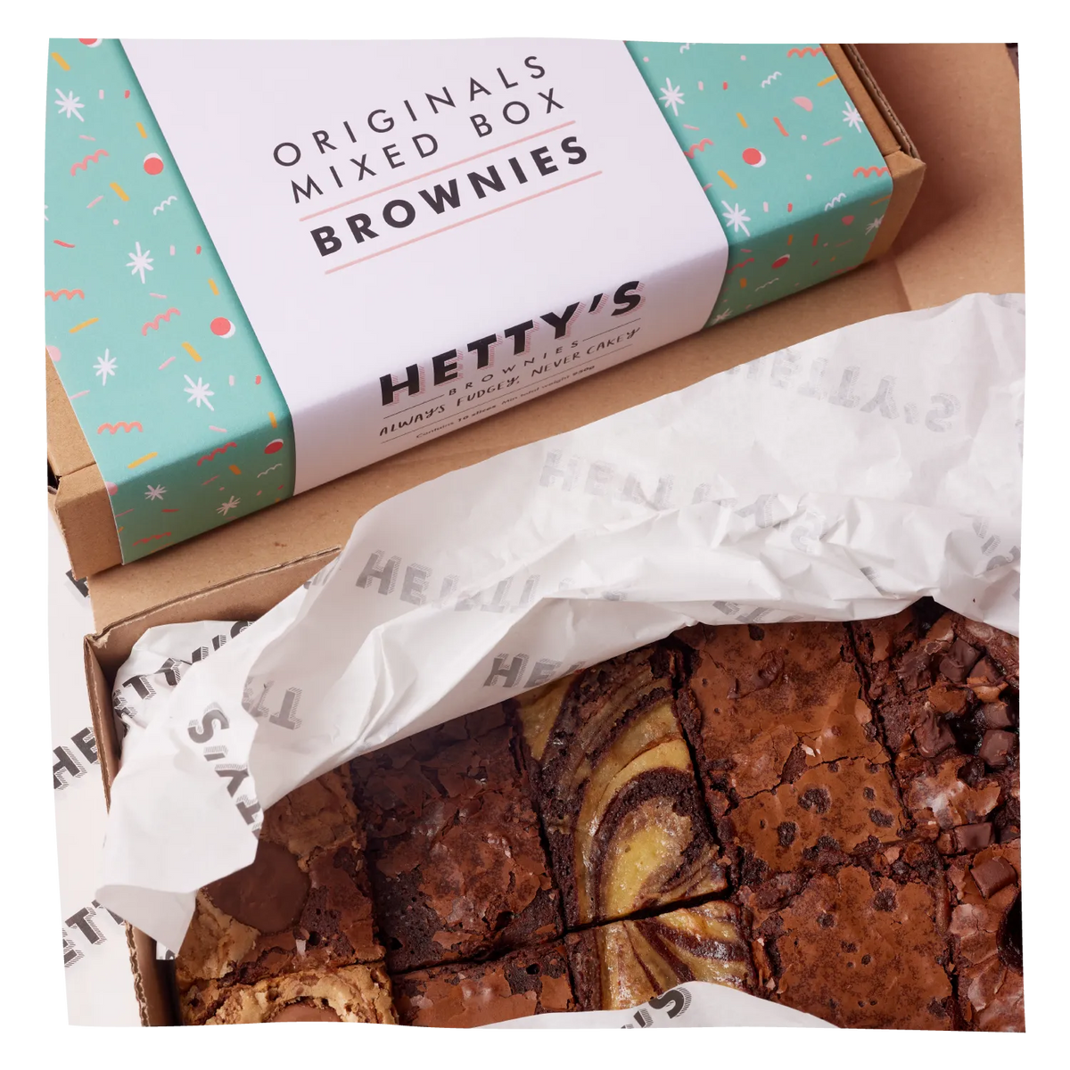 A box of Hetty's Originals Mixed Box Brownies shown open, with the branded lid resting above and the brownies visible inside on white tissue paper.