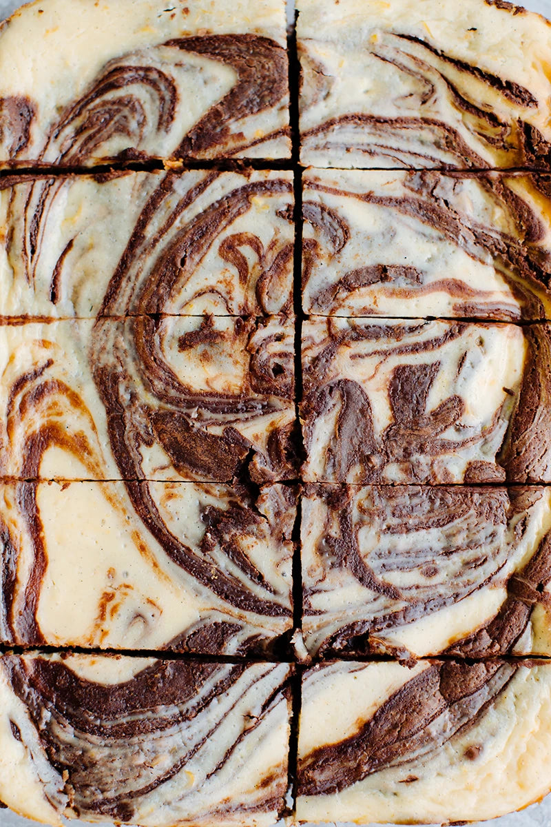 A top-down close-up of a baked brownies cut into slices